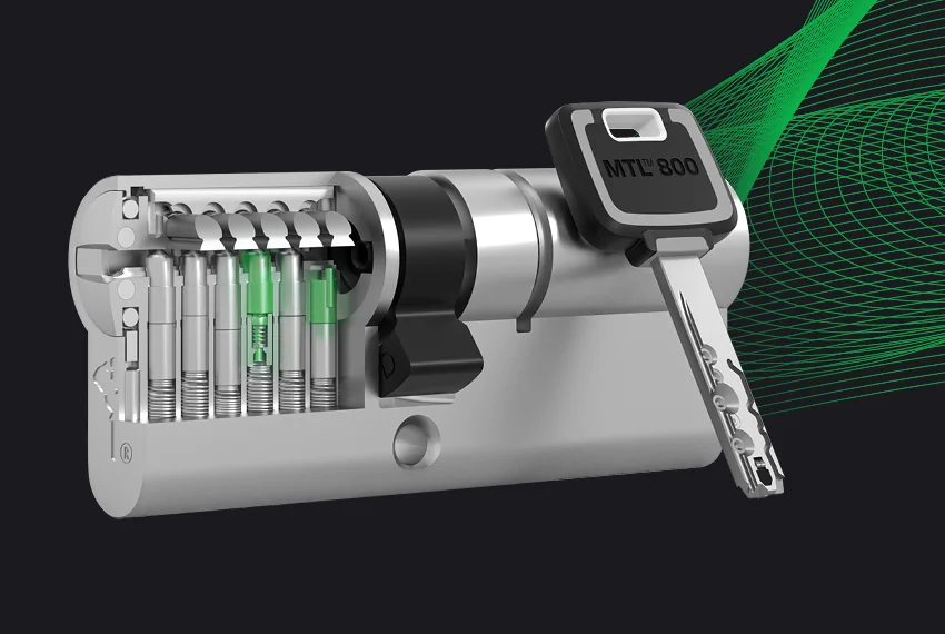 Cutaway of a Mul-T-Lock MTL800 cylinder showing telescopic pins and key